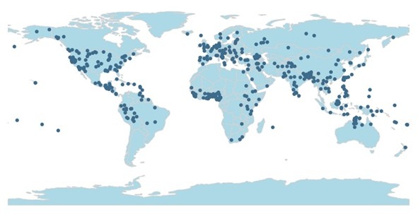 Map of world in light blue, with darker blue dots showing where the languages LSA members study are spoken. Pattern shows dense dots in North America, Central America, the Carribean, northern regions of South America, Europe, the Middle East and Indian subcontent, archipelegos around Indonesia, and parts of Australia. Scattered dots in other aeas as well.